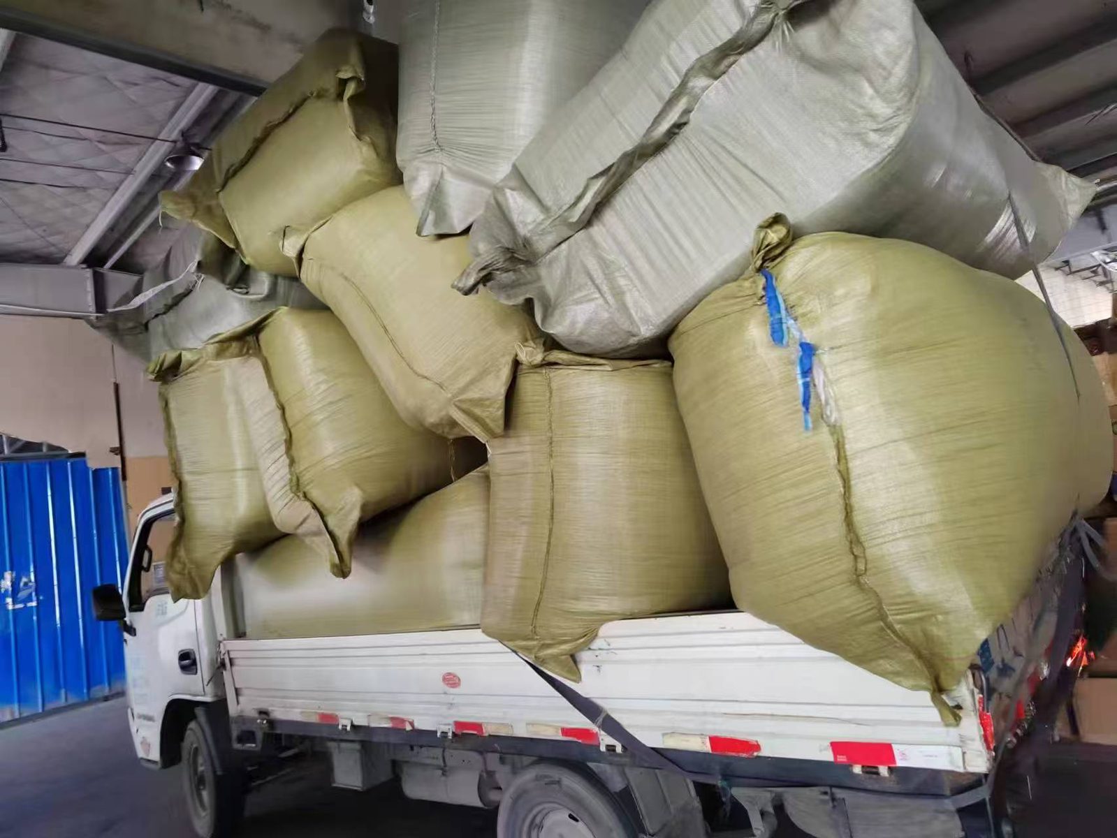 Bagged goods being loaded for transport